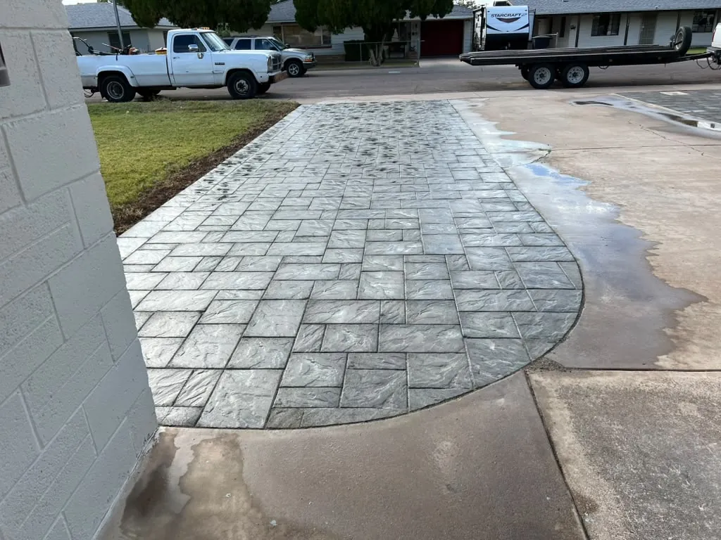 New lawn edged in curbing with young citrus going in